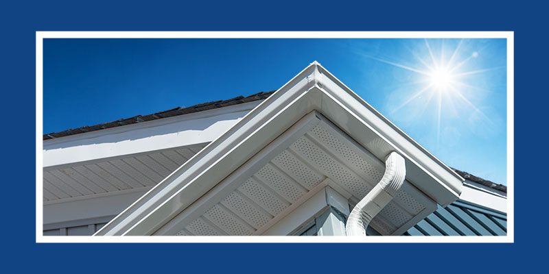 Sun shining down on a home's gutters.